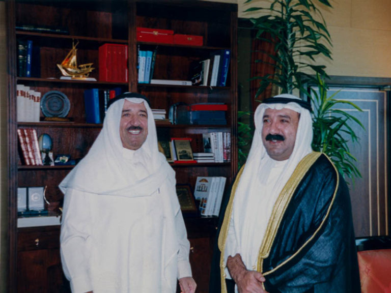 With his father on the day he became Minister of the Amiri Diwan
